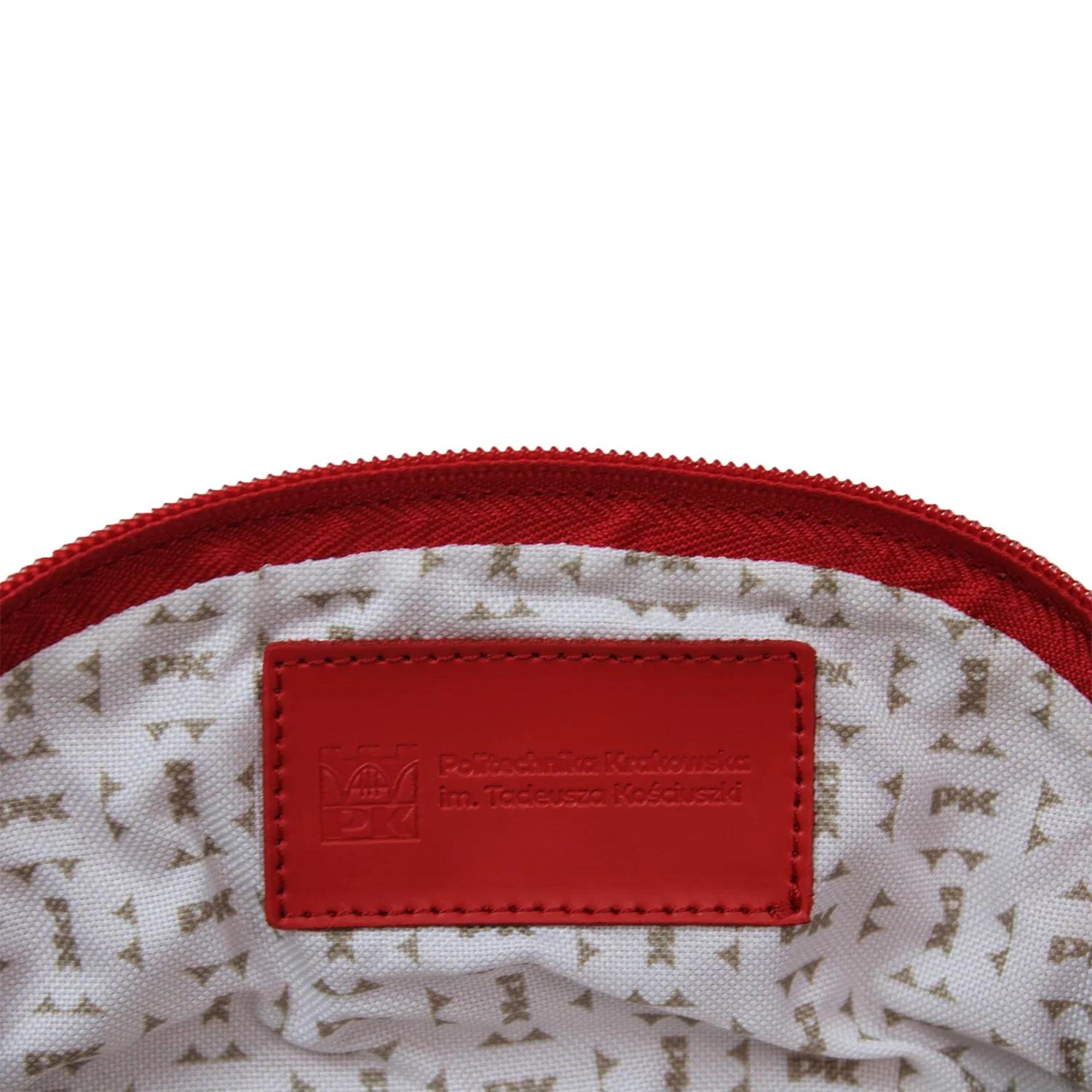 BATYCKI leather toiletry bag - Cracow University of Technology Store BATYCKI leather toiletry bag red with Cracow University of Technology logo inside - close-up on logo