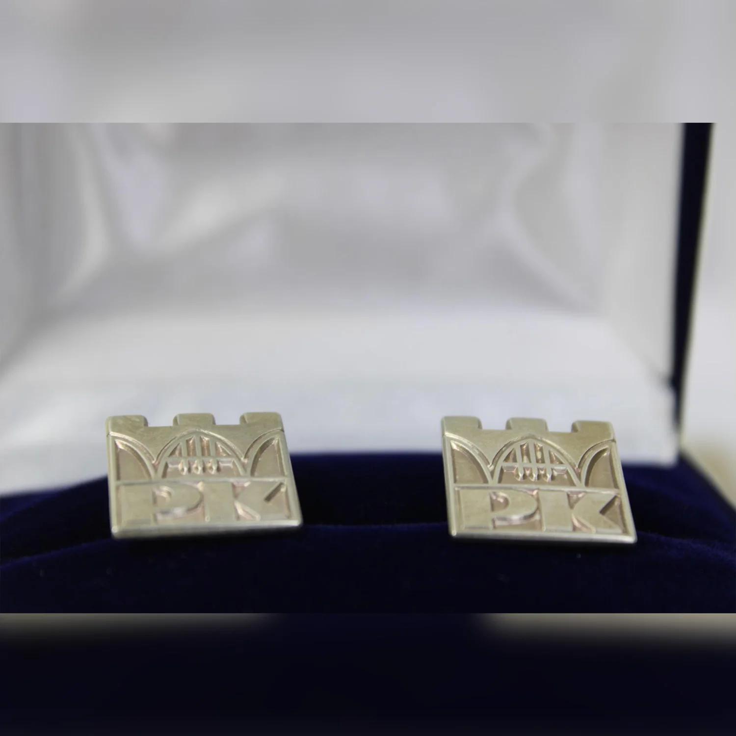 Cufflinks (S) - Cracow University of Technology Store Silver cufflinks in the shape of the Cracow University of Technology logo - cufflinks in a box, close-up to cufflinks