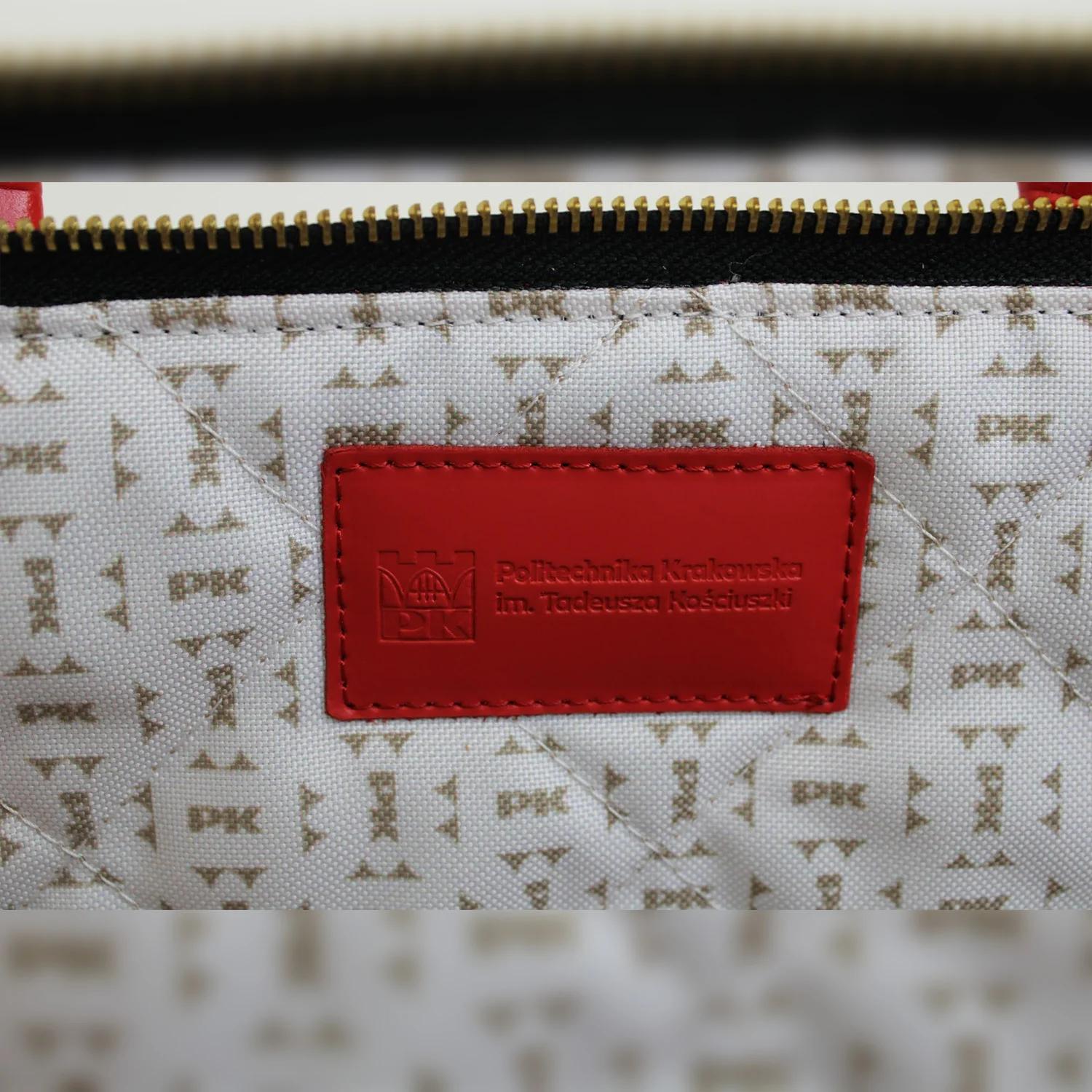 BATYCKI laptop bag - Cracow University of Technology Store BATYCKI laptop bag red with Cracow University of Technology logo inside - close-up to logo